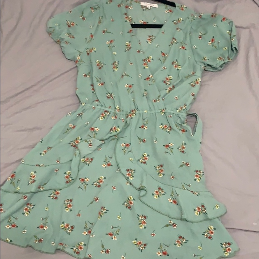 Fall in love with this mellow green dress.